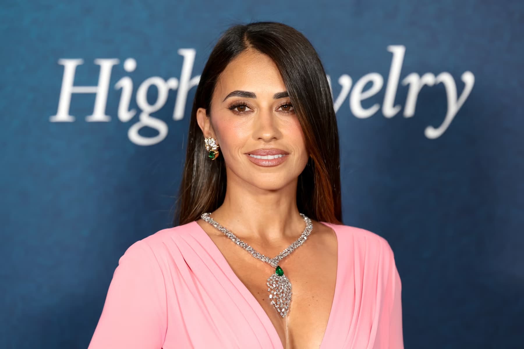 Antonela Roccuzzo in a pink gown and diamond necklace at a high jewelry event