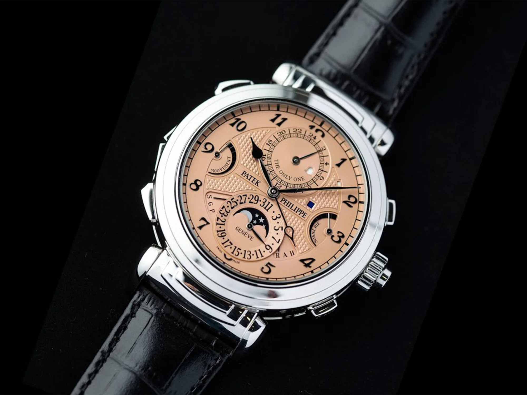 A Patek Philippe Grandmaster Chime with a salmon dial on a black alligator strap