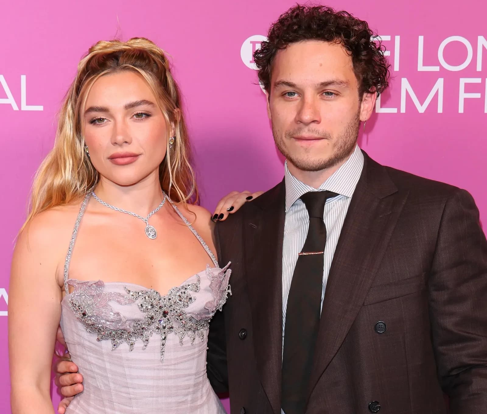 Florence Pugh and Finn Cole posing together at a red carpet premiere