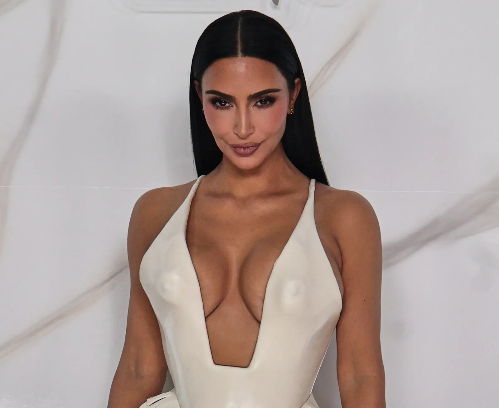 Kim Kardashian wearing a sculptural white Schiaparelli couture gown with a molded bodice