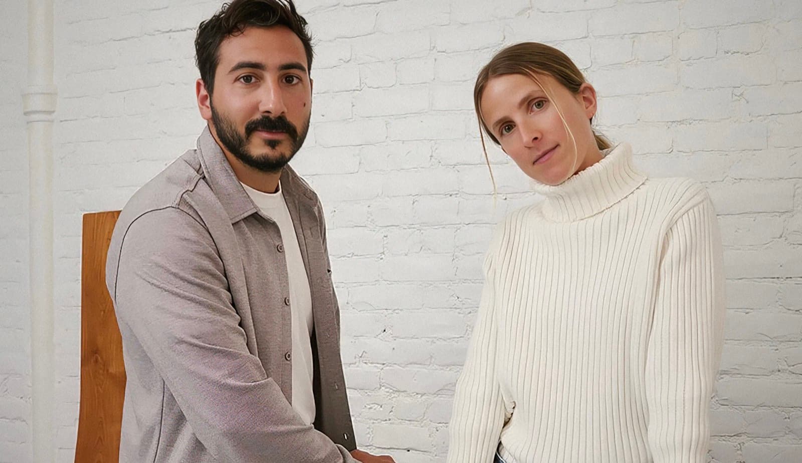 Still Here founders Sonia and Maurice Mosseri photographed against a white brick wall